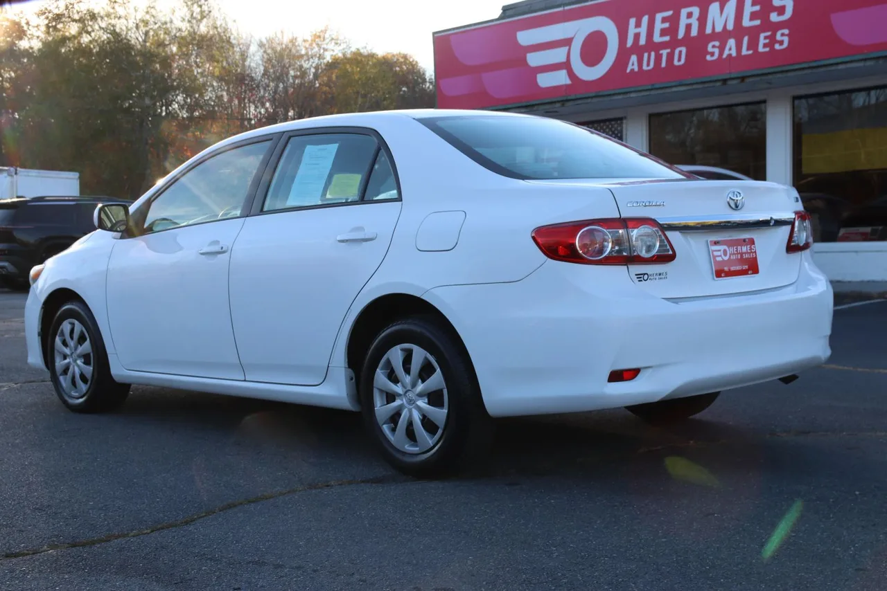 2011 Toyota Corolla LE Sedan 4D in white — photo 7 of 40