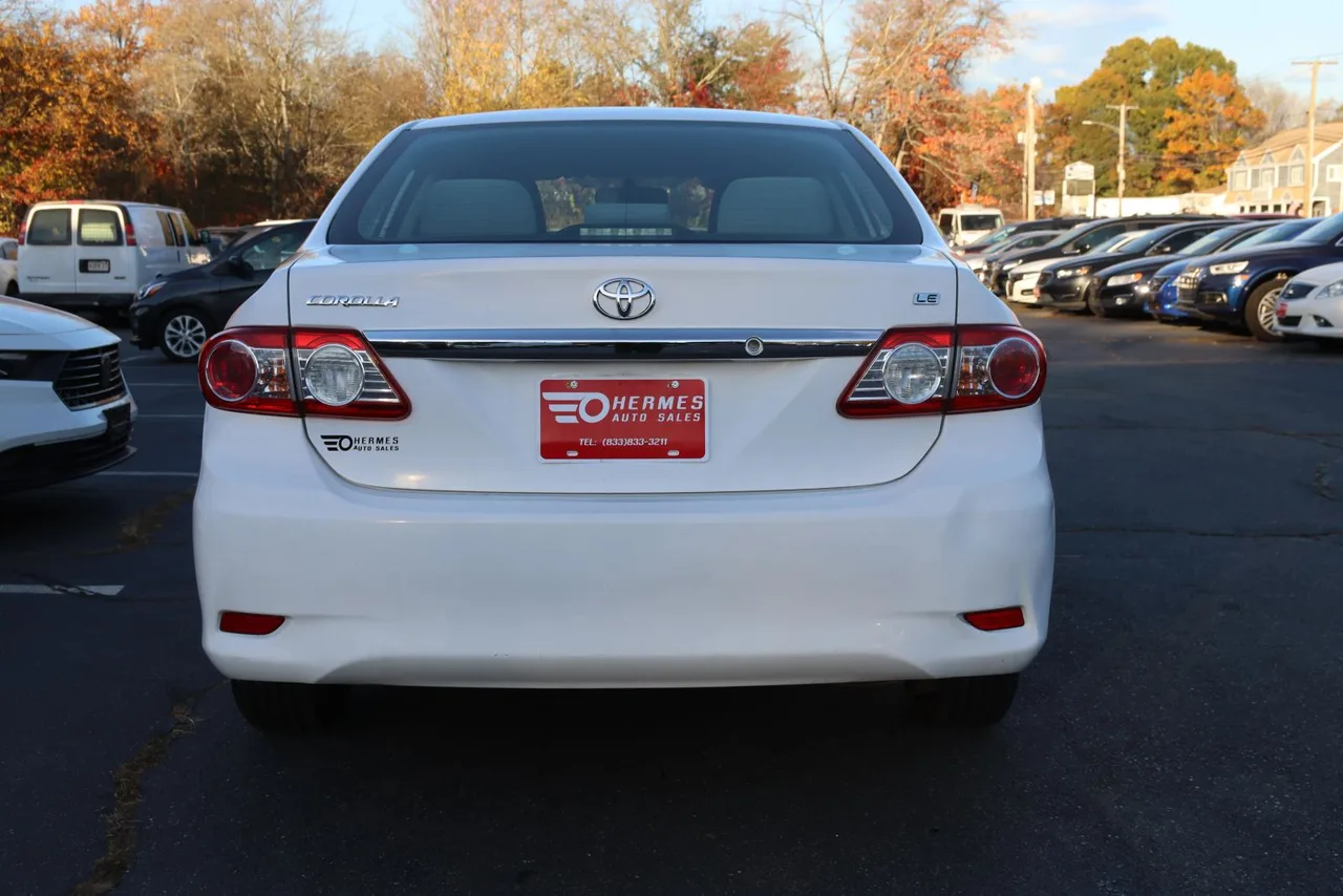 2011 Toyota Corolla LE Sedan 4D in white — photo 9 of 40
