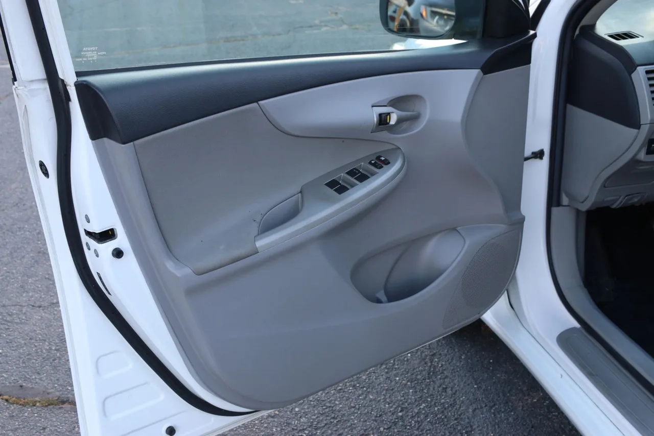 2011 Toyota Corolla LE Sedan 4D in white — photo 12 of 40