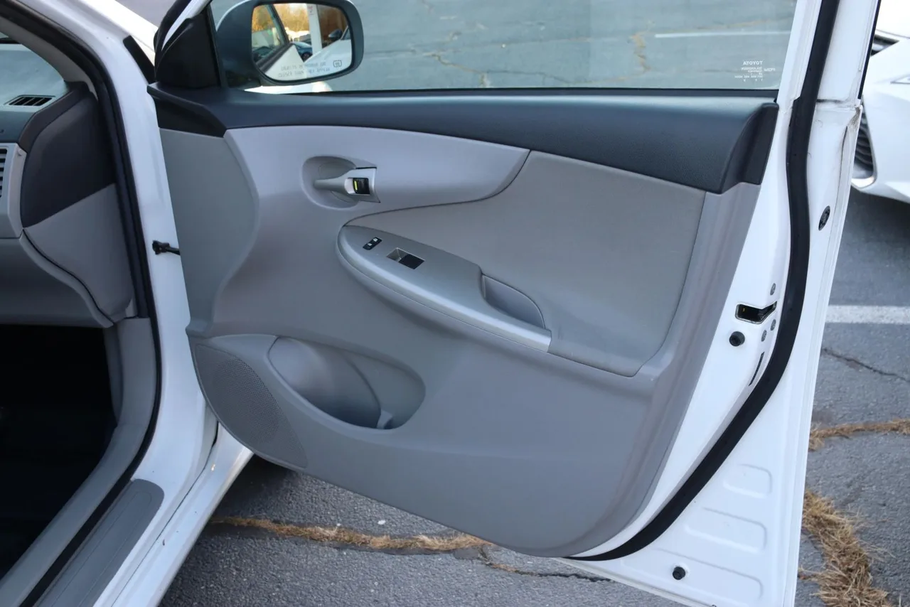2011 Toyota Corolla LE Sedan 4D in white — photo 22 of 40