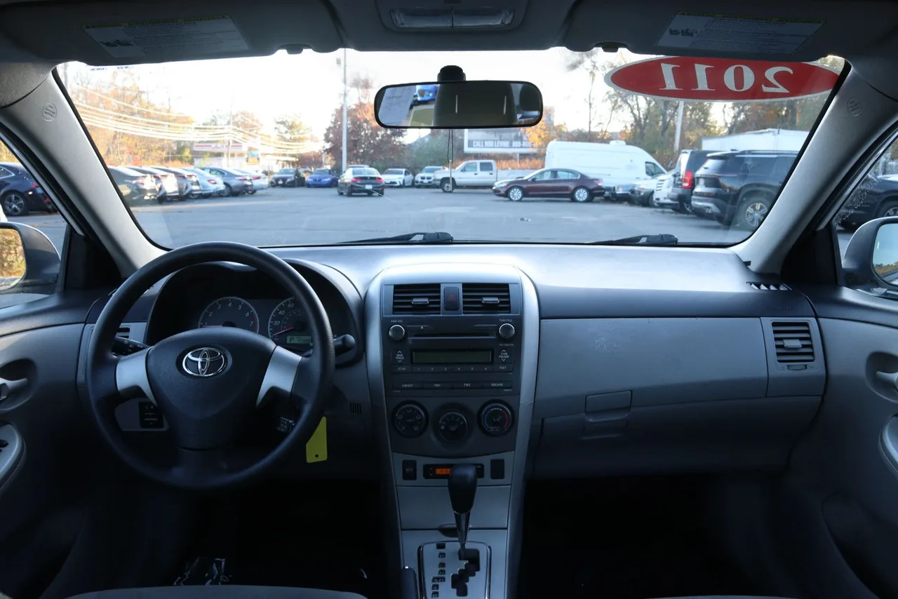 2011 Toyota Corolla LE Sedan 4D in white — photo 26 of 40
