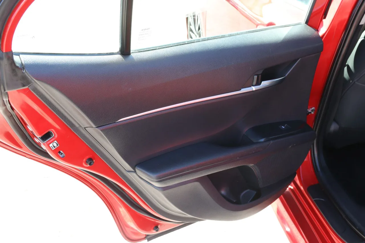 2019 Toyota Camry SE Sedan 4D in red — photo 16 of 37