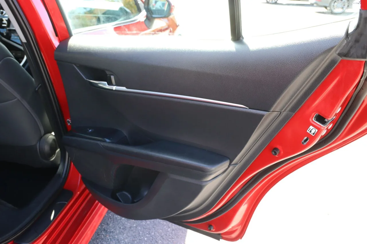 2019 Toyota Camry SE Sedan 4D in red — photo 18 of 37