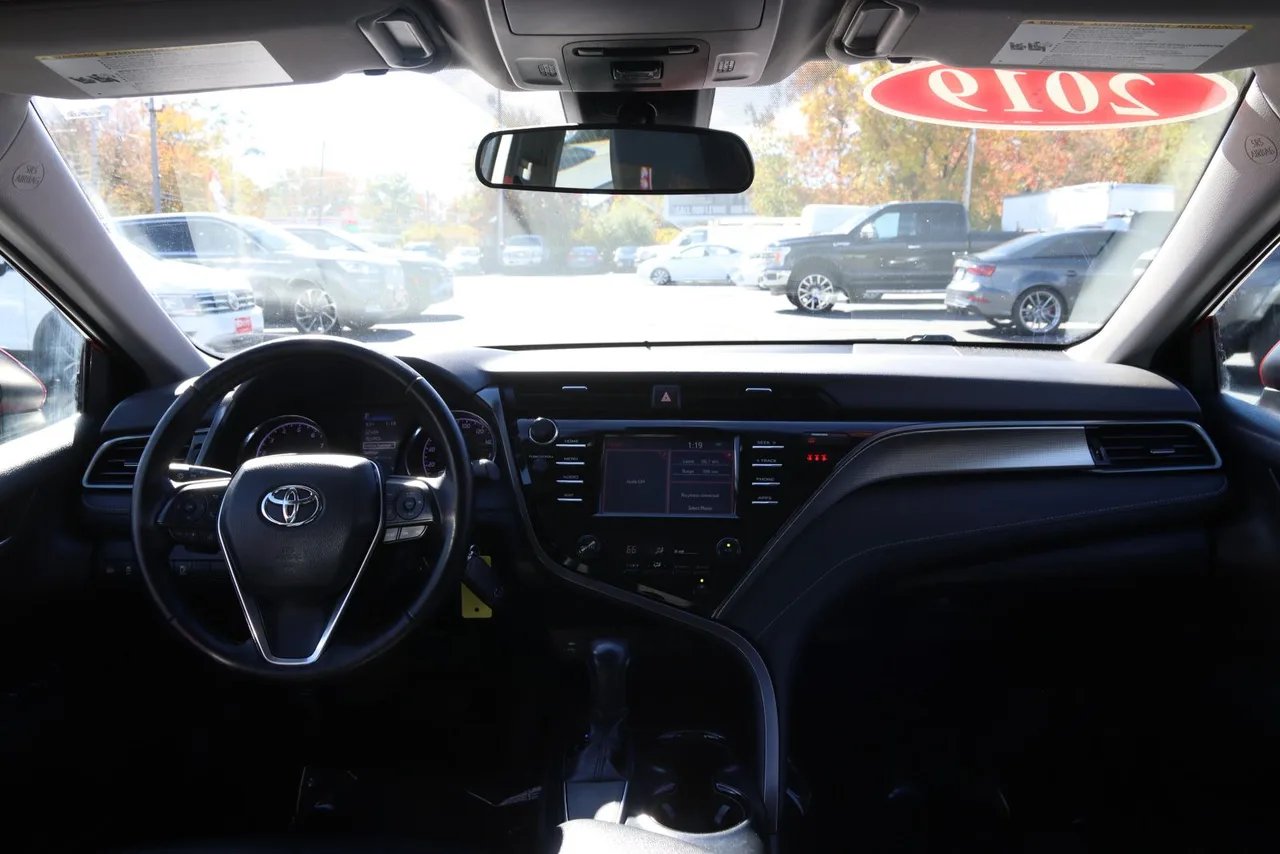 2019 Toyota Camry SE Sedan 4D in red — photo 24 of 37